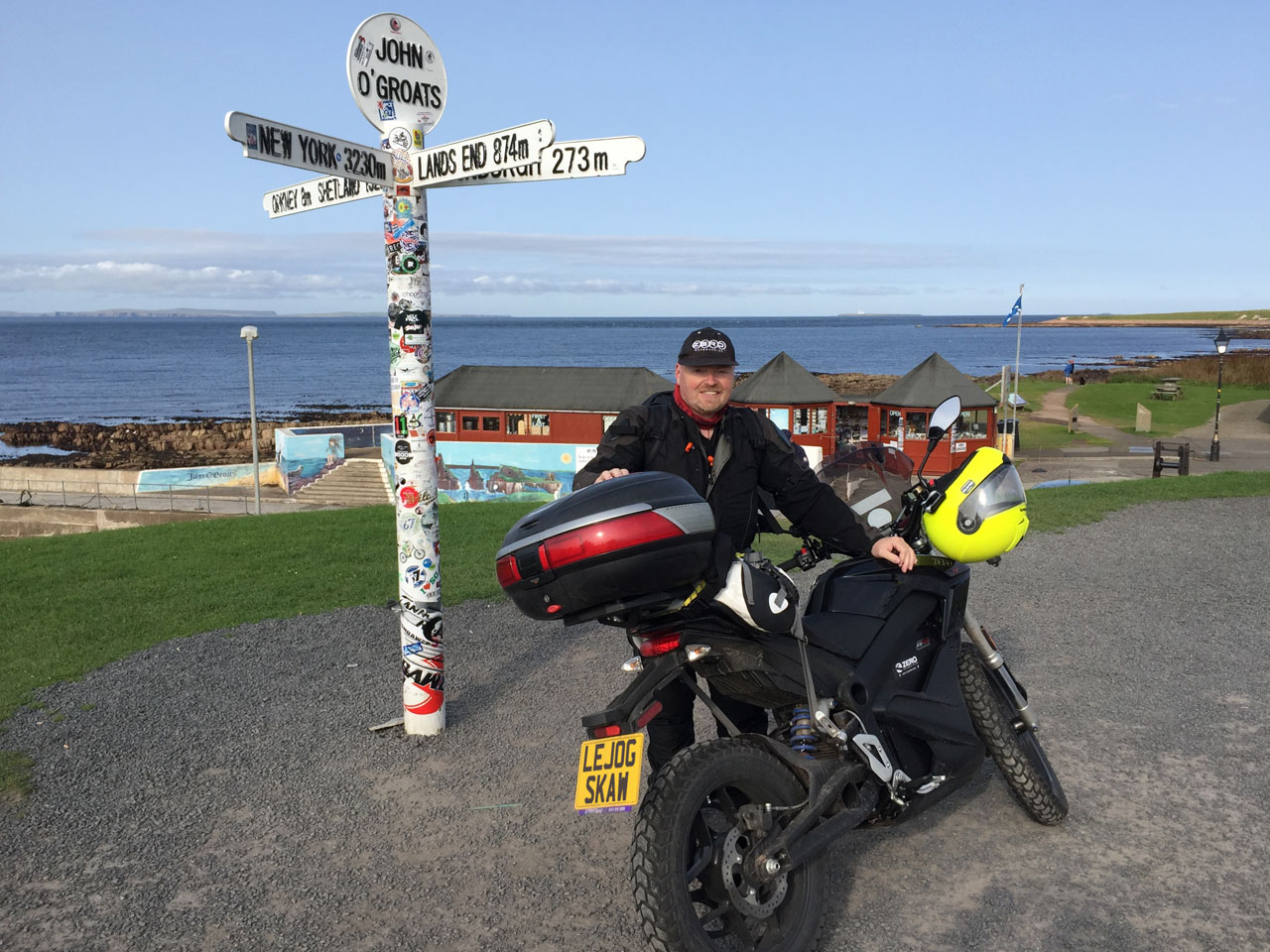 John Chivers and his Zero DSR electric motorcycle at John O'Groats.